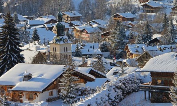 megeve-village-france-snow-covered-rooftops-historic-church-mountain-backdrop-haute-savoie