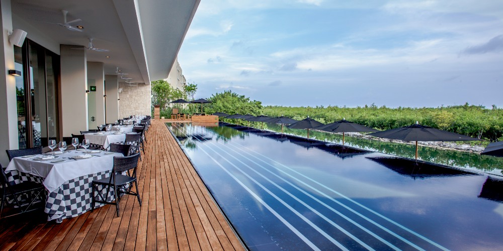 terra-nostra-restaurant-overlooking-infinity-pool-nizuc-resort-and-spa-yucatan-peninsula-2022
