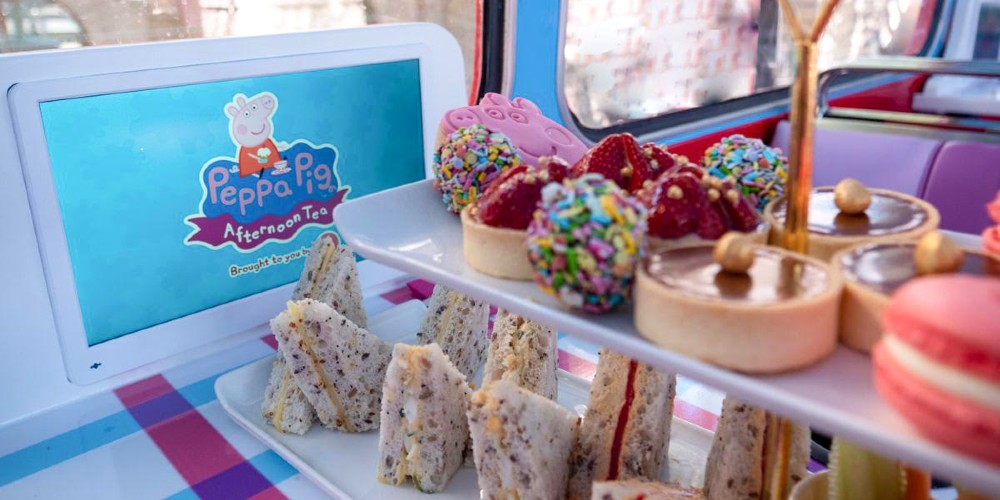 peppa-pig-afternoon-tea-bus-tour-tea-table-with-cakestand-london-2022