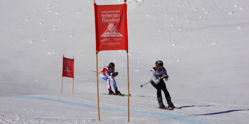 two-competing-skiers-murren-switzerland-worlds-longest-downhill-racing-course-january-2022