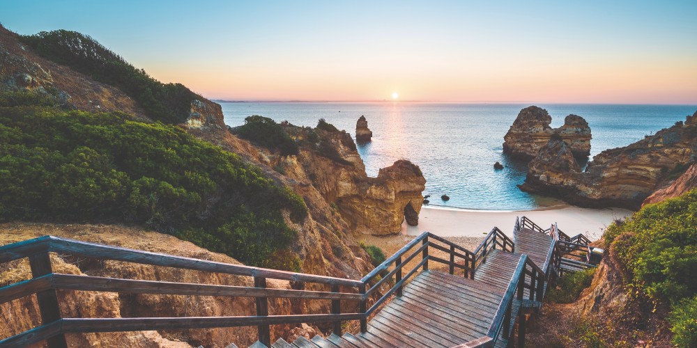wooden-staircase-to-cove-like-beach-the-algarve-portugal-family-traveller-2022