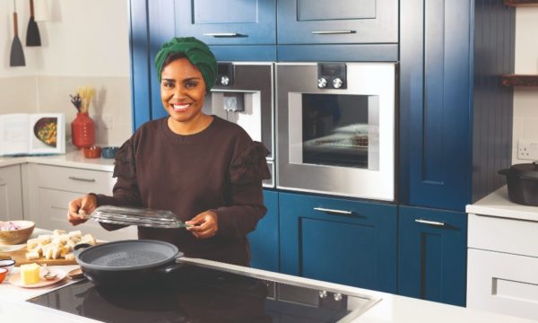 nadiya-hussain-cooking-in-kitchen-family-traveller-magazine-interview-summer-issue-2022