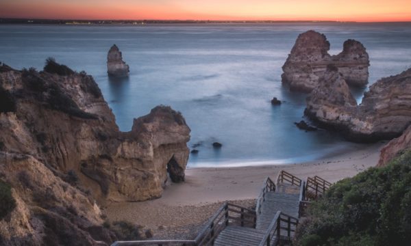 praia-do-camilo-western-algarve-staircase-down-to-beach-with-rock-formations-sunset-2022
