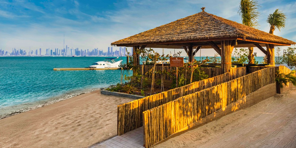 anantara-world-islands-resort-welcome-reception-area-view-of-city-across-arabian-gulf-2022