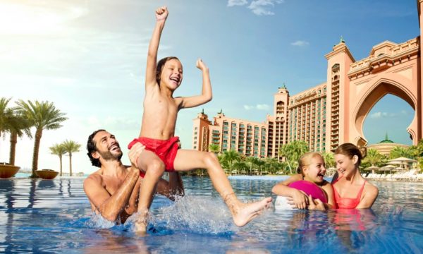 atlantis-the-palm-dubai-family-playing-in-royal-pool-kenwood-travel-summer-holiday-sale-2022