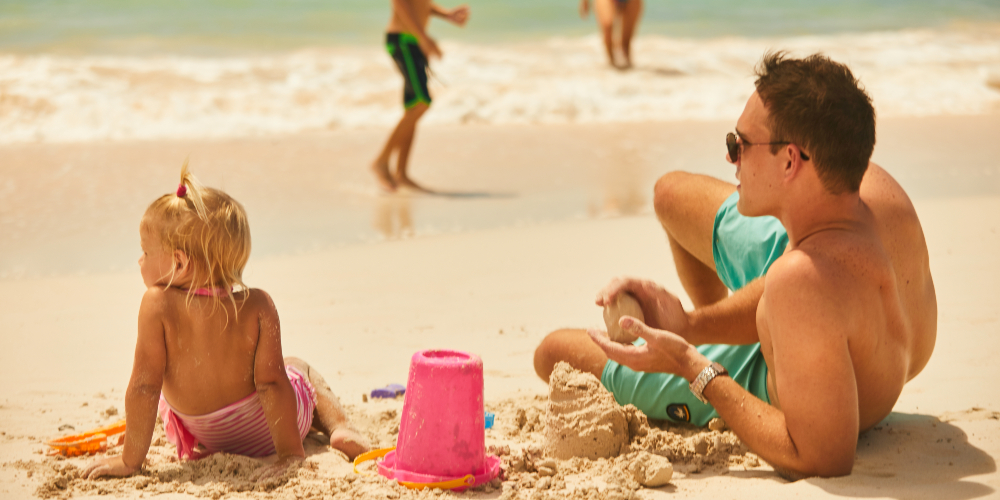 father-daughter-sandcastle-building-sea-breeze-beach-house-barbados-caribbean-summer-family-holidays-2022