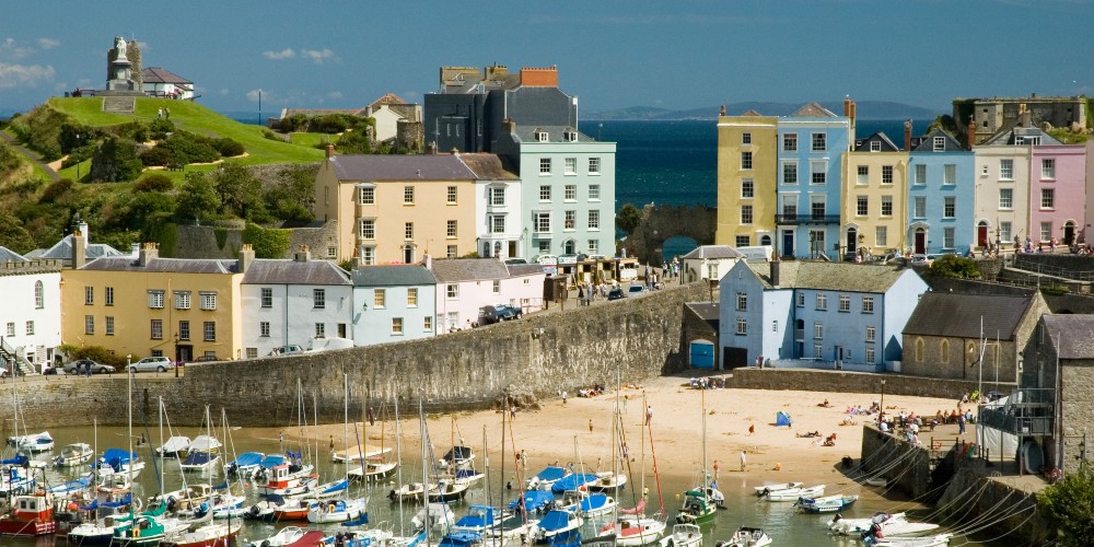 tenby-harbour-west-wales-colourful-houses-fishing-boats-uk-staycations-2022-family-traveller