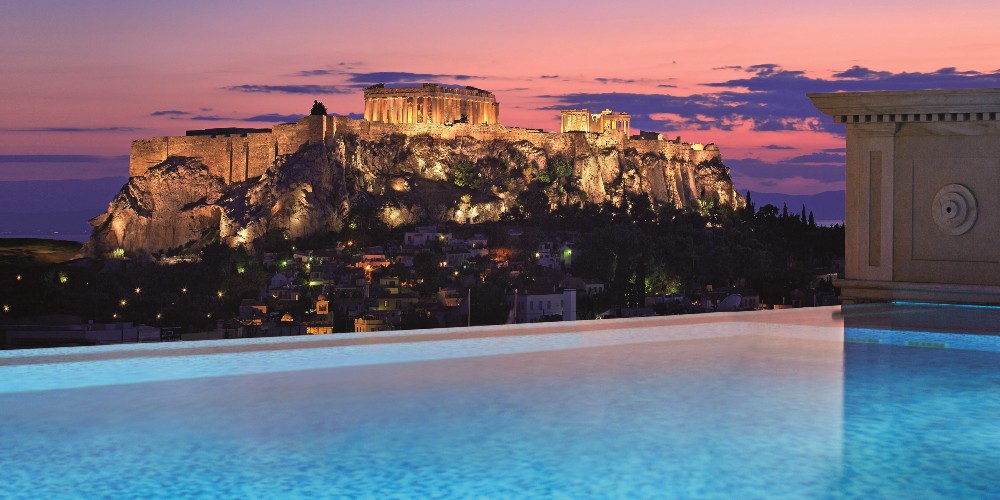 view-of-acropolis-at-sunset-from-rooftop-pool-luxury-hotel-grand-bretagne-athens-2022