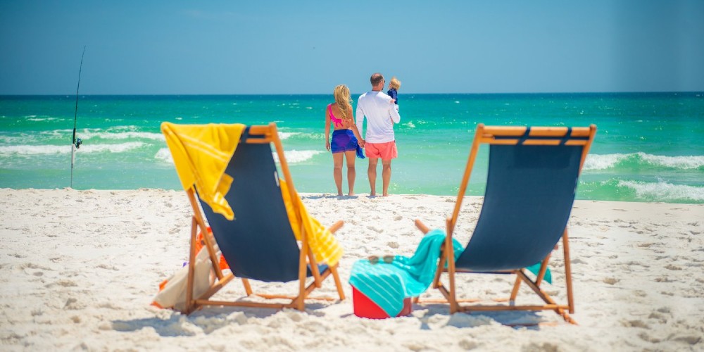 visit-pensacola-family-beach-deck-chairs-white-sand-gulf-of-mexico-2022