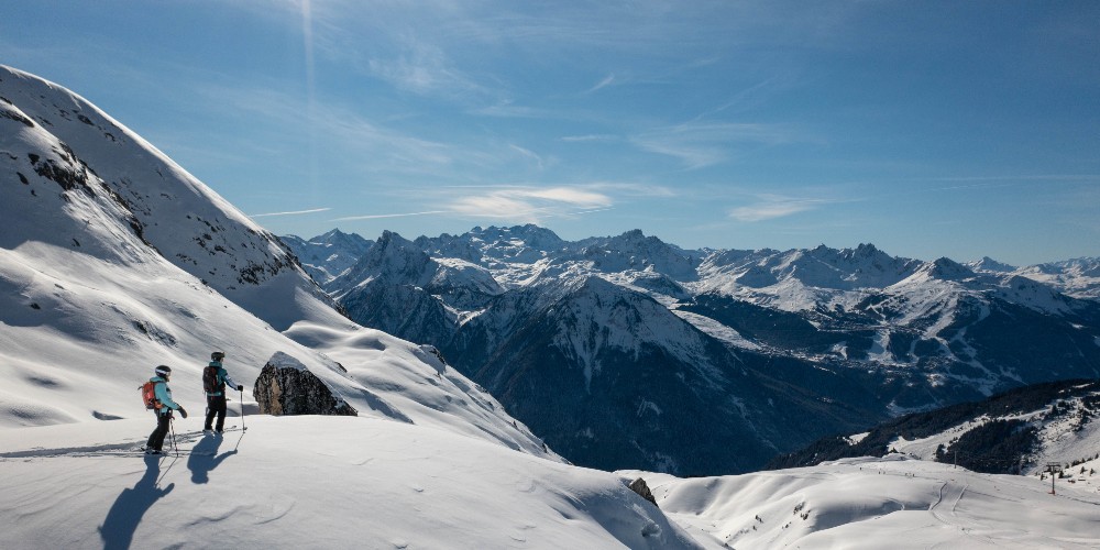 la-plagne-ski-holidays-skiers-mountain-top-winter-2022