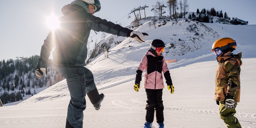 alpendorf-family-skiing-holidays-austria-kids-with-ski-instructor