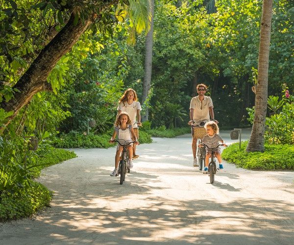 family-cycling-tropical-island-jungle-vakkaru-resort-maldives-nick-savage