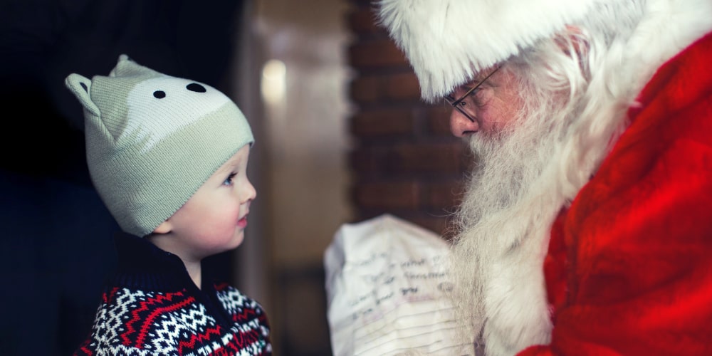 Boy brings his list to santa