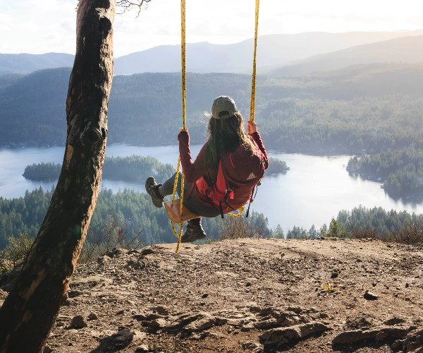 woman-swing-overlooking-shawnigan-lake-vancouver-island-tourism- cowichan-peter-ohara-hero