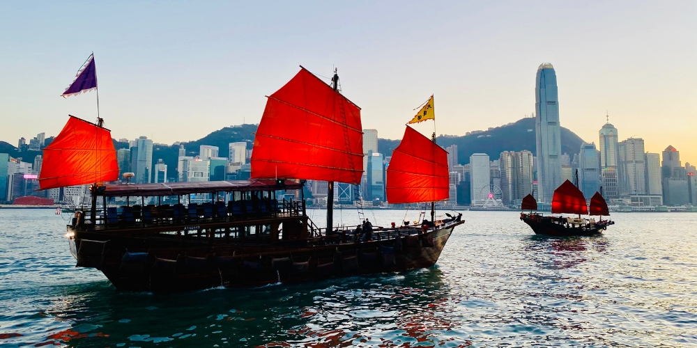 traditional-chinese-junks-with-red-sails-hong-kong-harbour