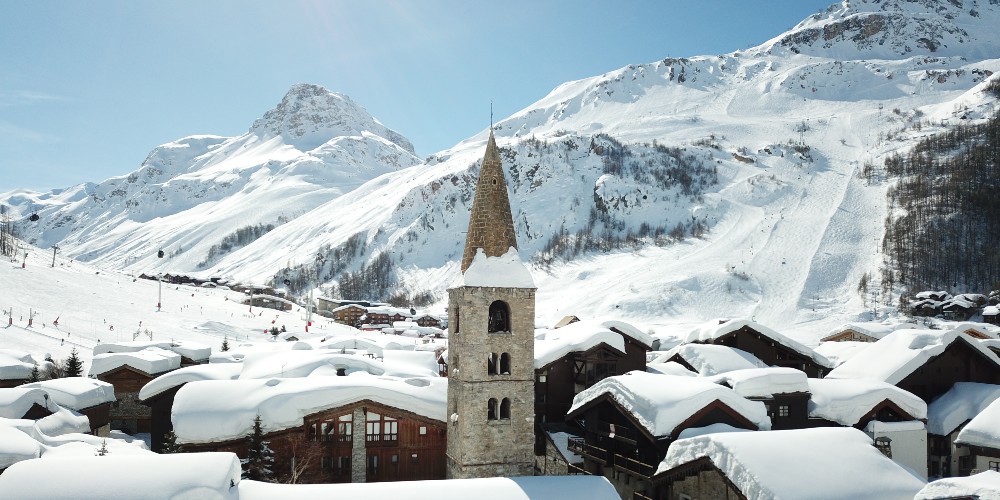 val-disere-village-with-church-snow-covered-mountains