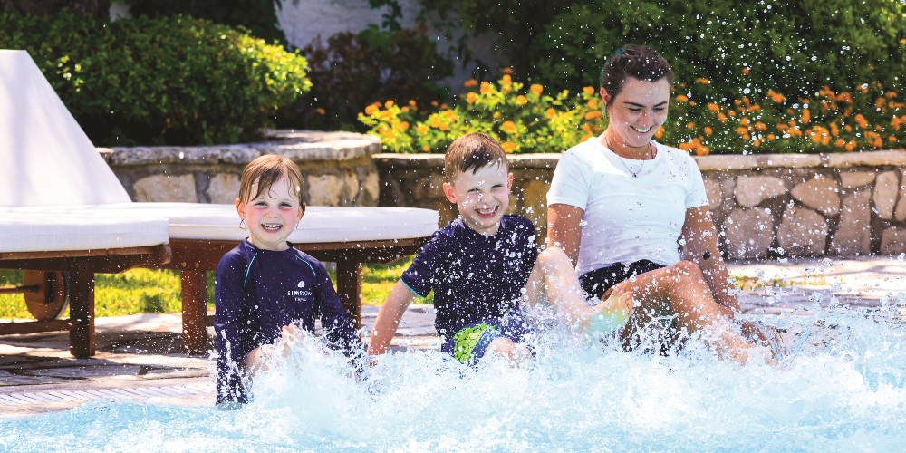 children-playing-by-pool-with-nanny-family-villa-holidays-europe