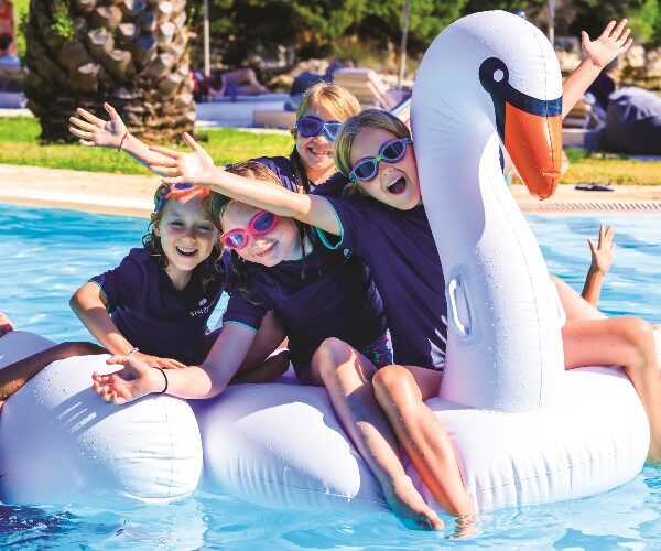 simpson-travel-holidays-children-in-pool-with-large-swan-inflatable