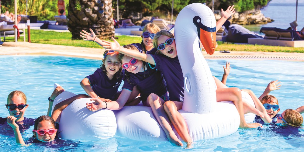 simpson-travel-holidays-children-in-pool-with-large-swan-inflatable