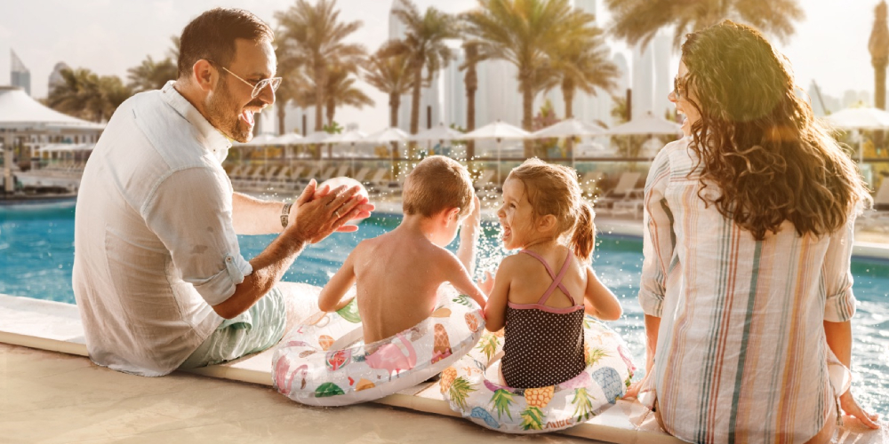 family-by-swimming-pool-dubai-holiday