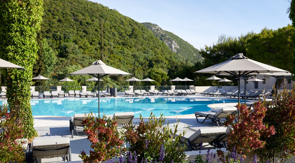 pool-area-mountain-backdrop-resort-greek-island