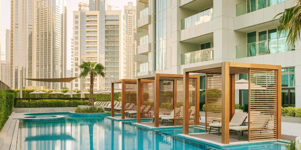 pool-with-cabanas-business-district-plum-guide