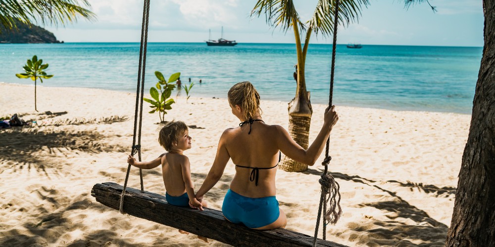 mother-and-child-rope-swing-paradise-island-beach