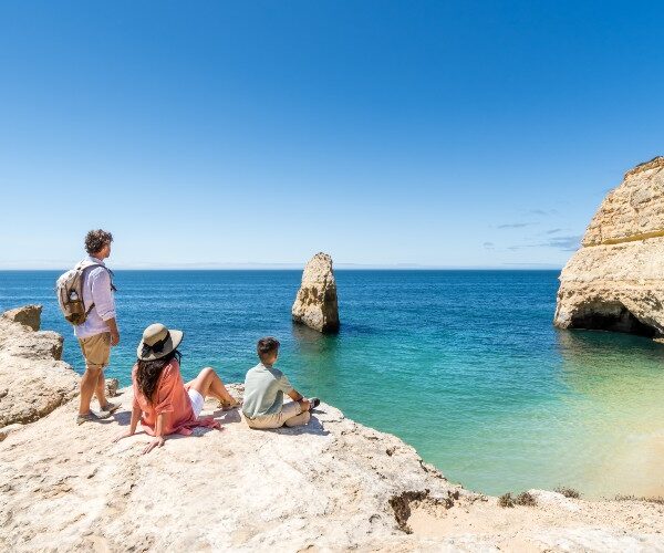 algarve-beach-family-sitting-on-cliff