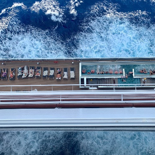aerial-view-of-passengers-on-sundeck-cruise-ship