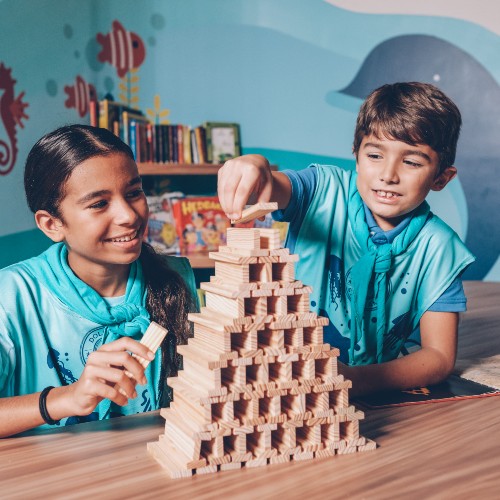 children-building-wooden-structure-kids-club
