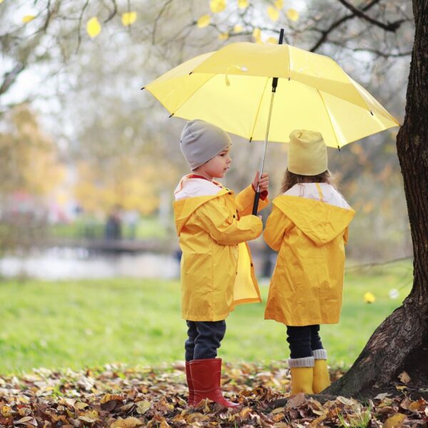 children-with-umbrellas-UK-weekend-break