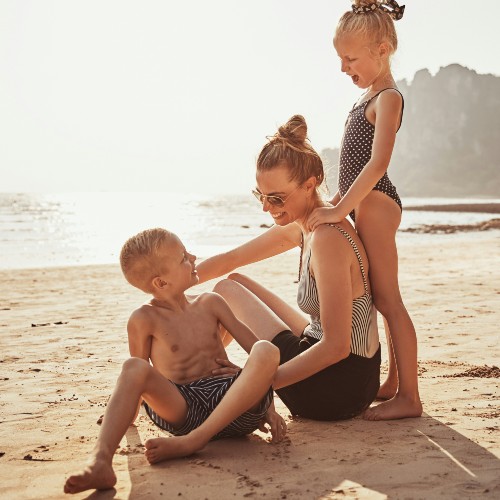 family-on-beach-getty-images