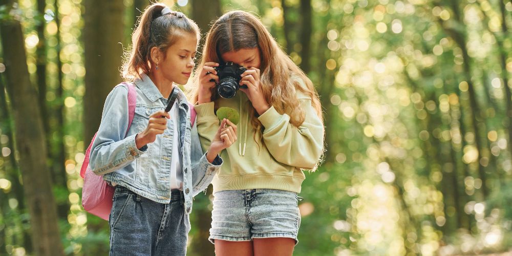 girls-with-camera-countryside-getty-images