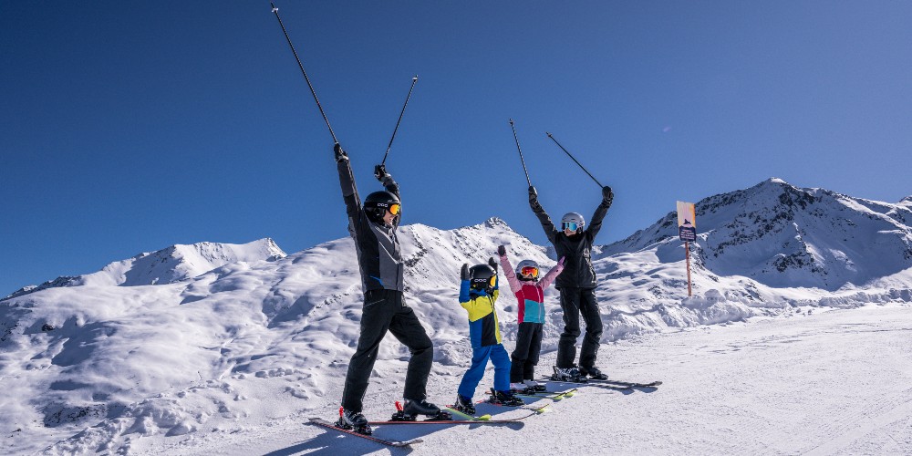 family-having-fun-ski-slopes