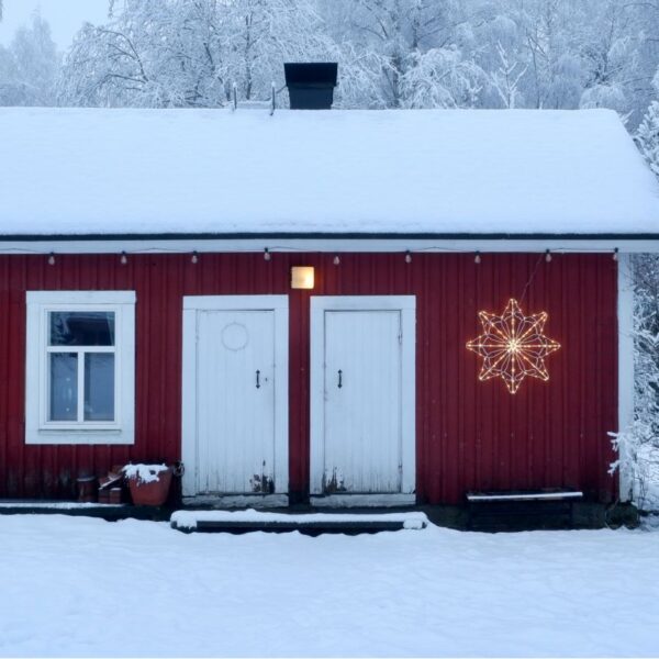 red-cabin-in-snowy-woods-winter-getaways-paul-van-oijen