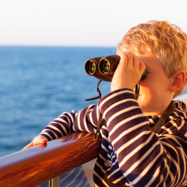 young-boy-binoculars-cruise-ship