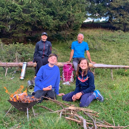 family-round-campfire-french-alps