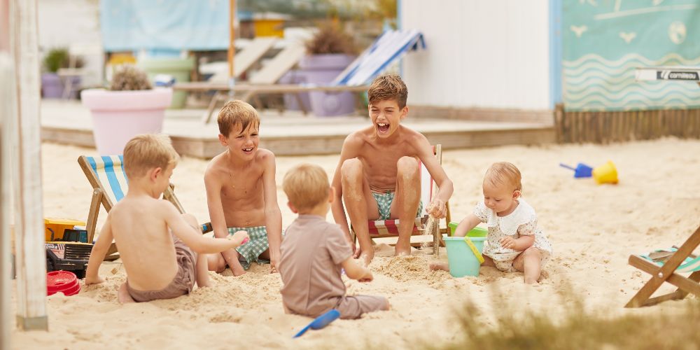 children-on-manmade-beach-english-countryside