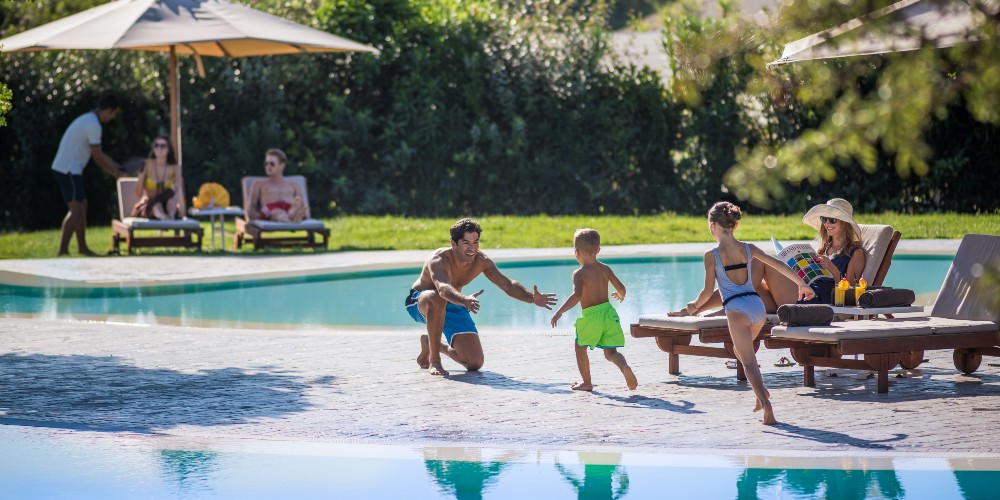 family-swimming-pool-resort-italy