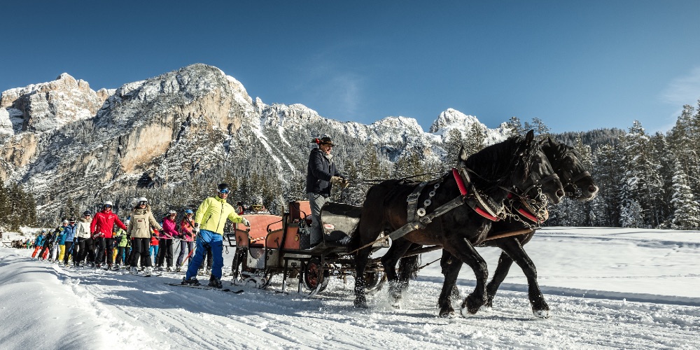 family-ski-trip-dolomites-horse-carriage-rides