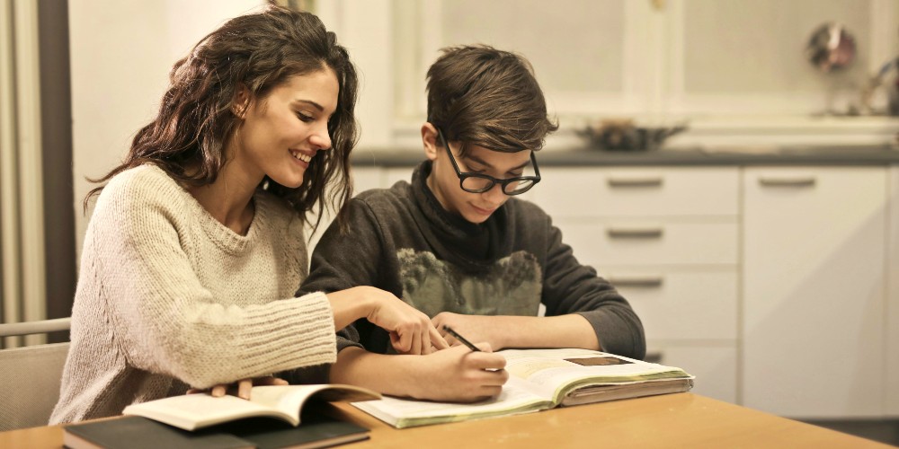 boy-learning-on-holiday-with-travelling-tutor