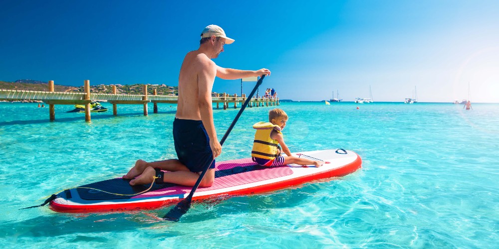 father-child-paddleboarding-holiday-in-corsica