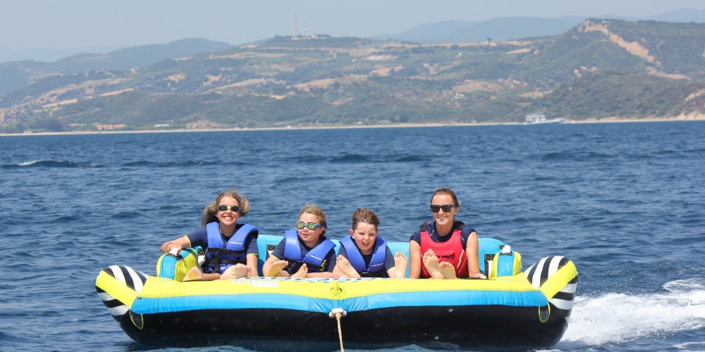 children-in-raft-scott-dunn-halkidiki