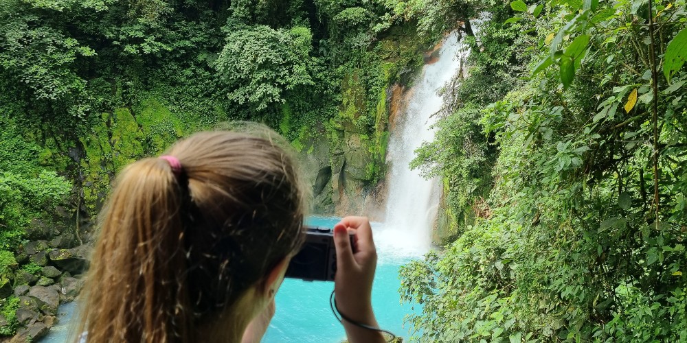 girl-filming-waterfall-costa-rica