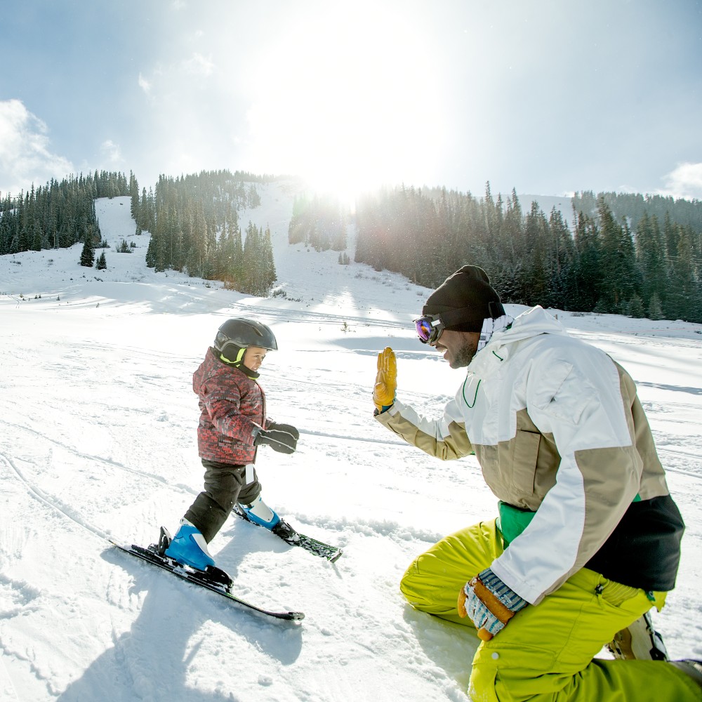 father-son-skiing-french-alps