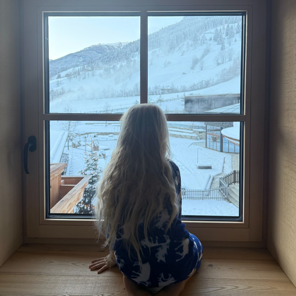 child-at-window-hotel-austria