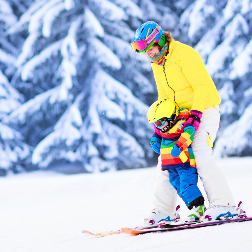 adult and child skiing