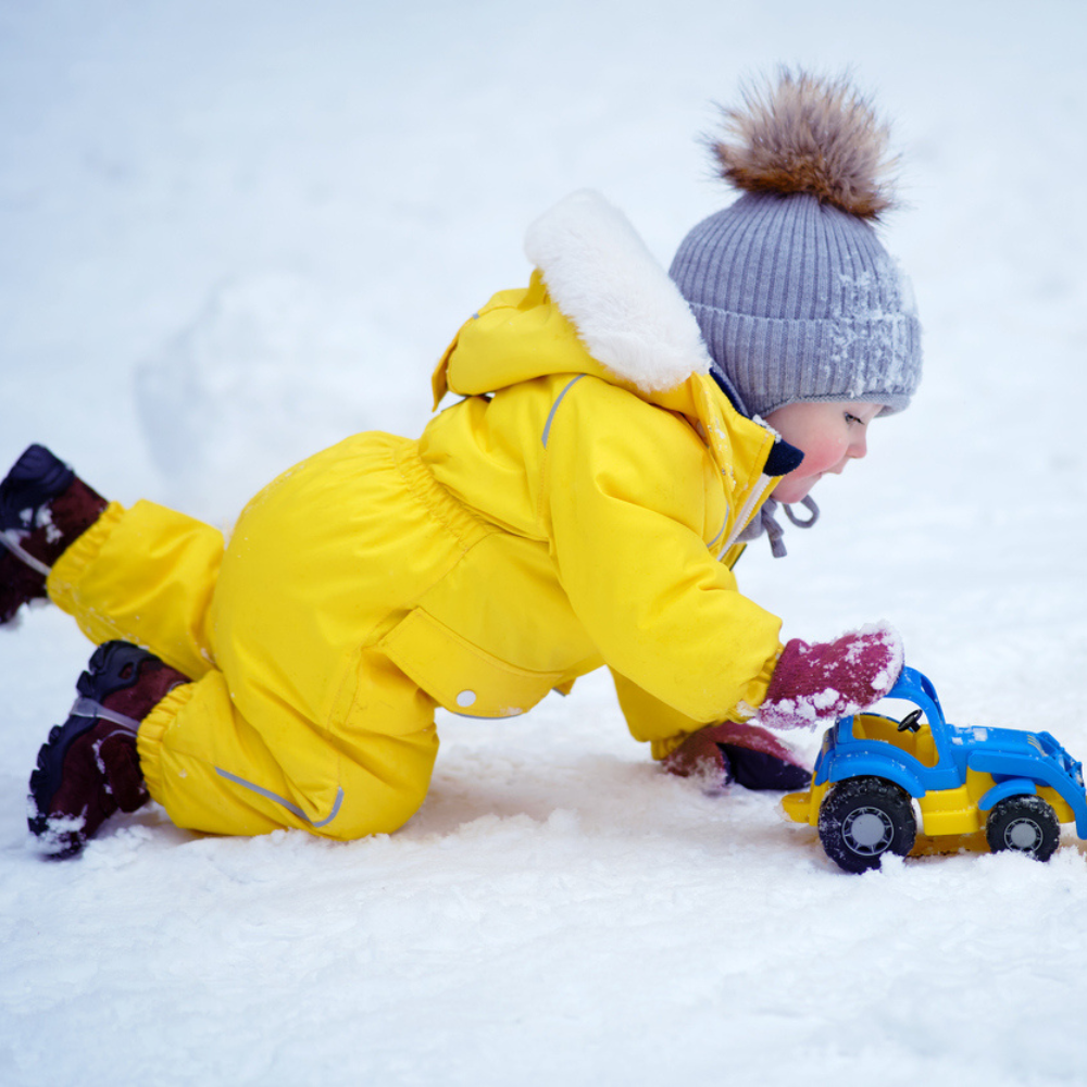 child playing in snow