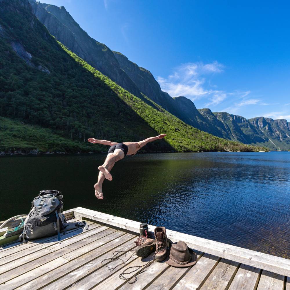 ewfoundland and labrador western brook man diving into lake
