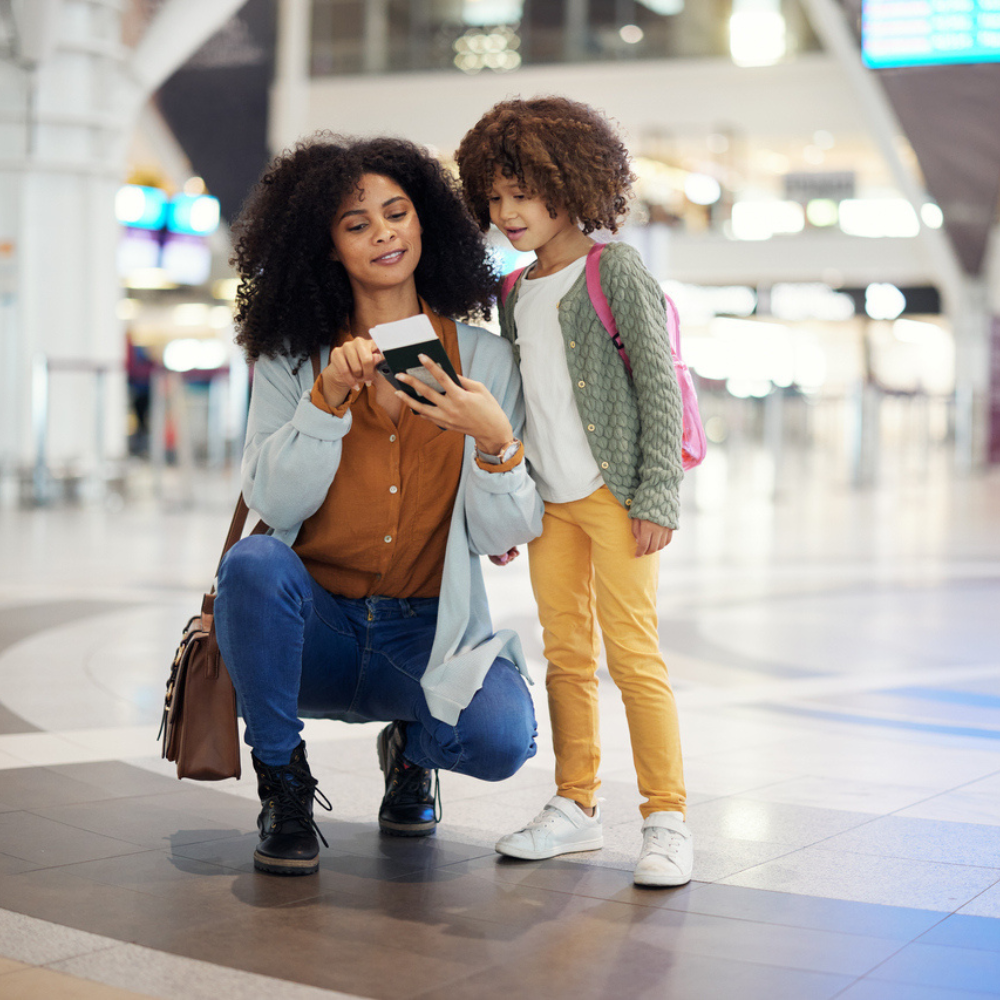 mother and child with passport in airport